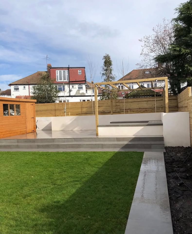 SGC completed garden with a timber pergola, porcelain patio, lawn and fencing